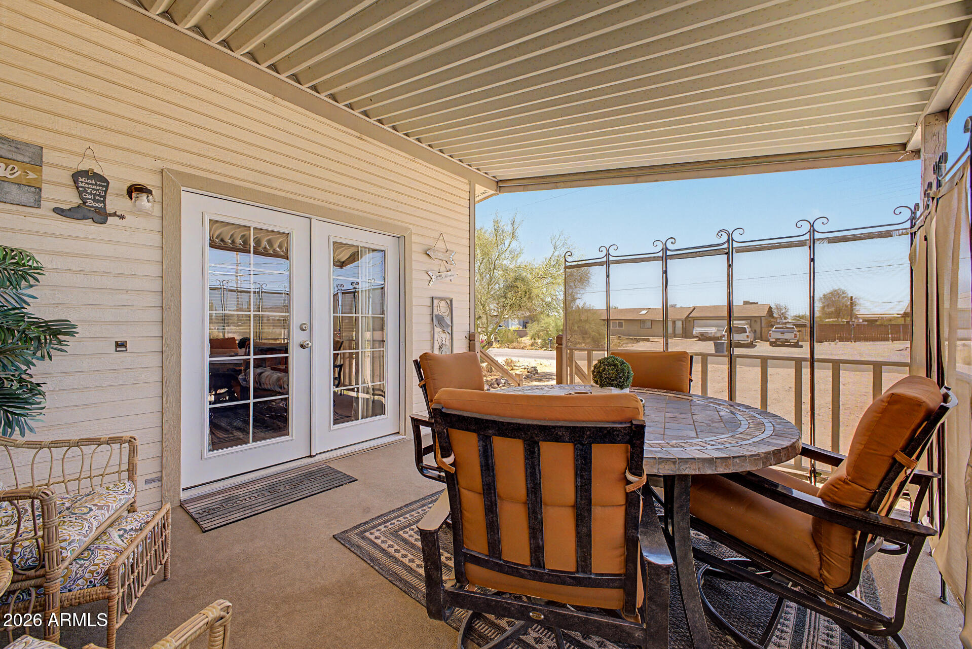 479 North Cactus Road Apache Junction, AZ 85119 - Photo 6 of 29 a balcony with table and chairs