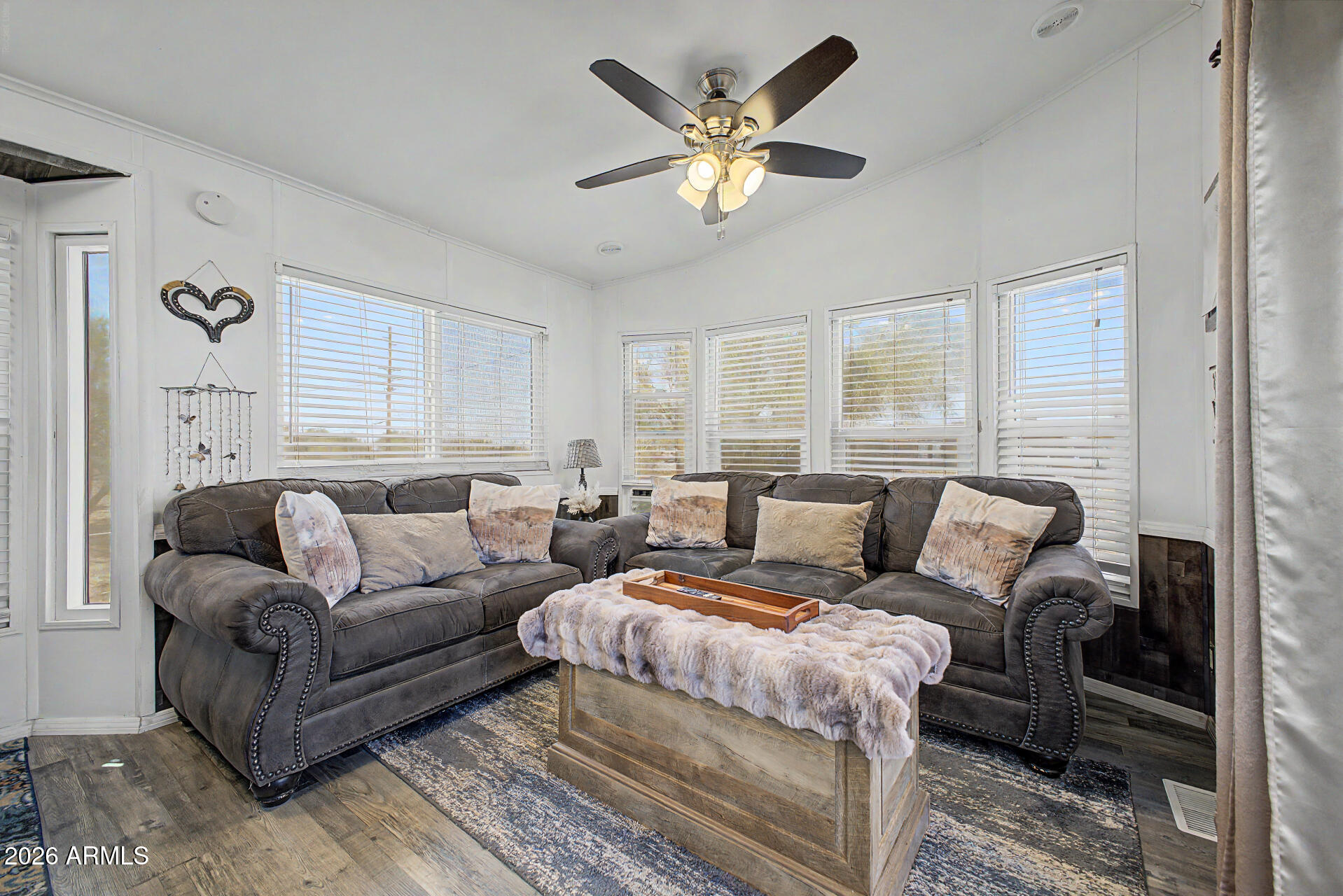 479 North Cactus Road Apache Junction, AZ 85119 - Photo 8 of 29 a spacious bedroom with a large bed couch and windows