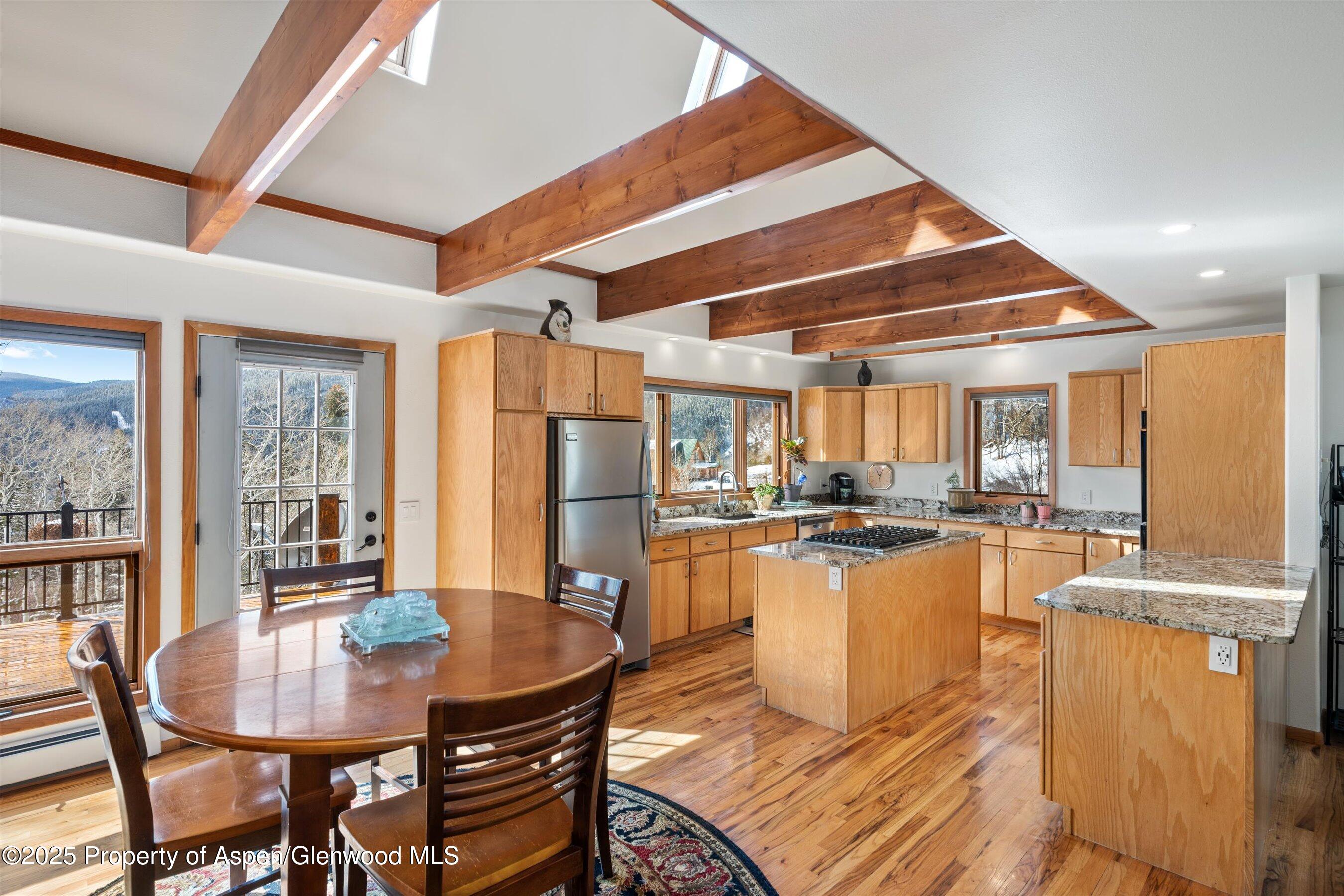 238 Hawk Lane Basalt, CO 81621 - Photo 17 of 46 a room with dining table and chairs