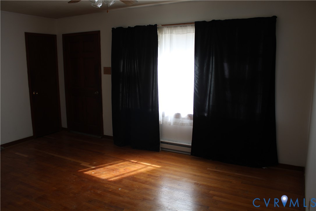 7421 Adkins Road Charles City, VA 23030 - Photo 9 of 14 wooden floor in an empty room