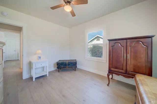 a view of a livingroom with furniture and a window