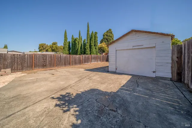 a view of backyard of a house
