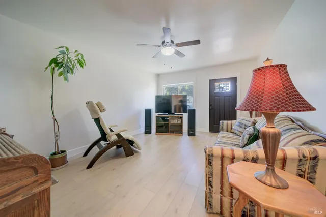 a view of a livingroom with workspace and a couch