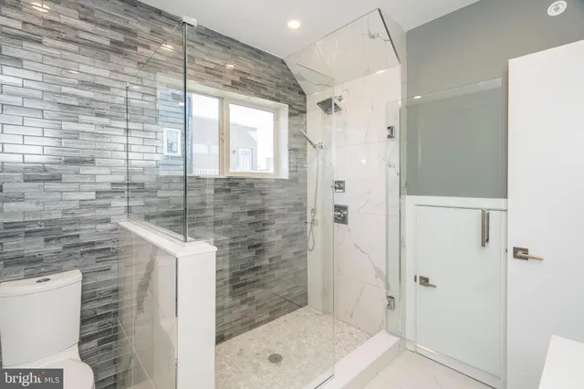 a bathroom with a shower and a sink