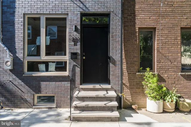 a view of a house with a tree