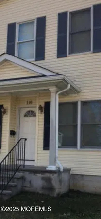a view of a house with a door and a window