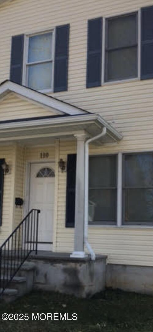 a view of a house with a door and a window