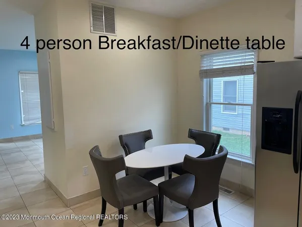 a view of a table and chairs in a room
