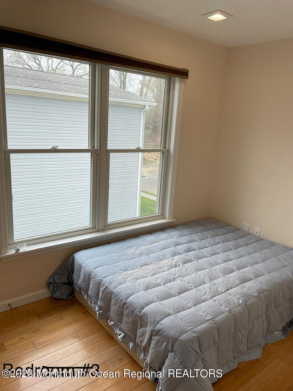 110 Poplar Avenue Deal, NJ 07723 - Photo 19 of 27 a bedroom with a bed and a window