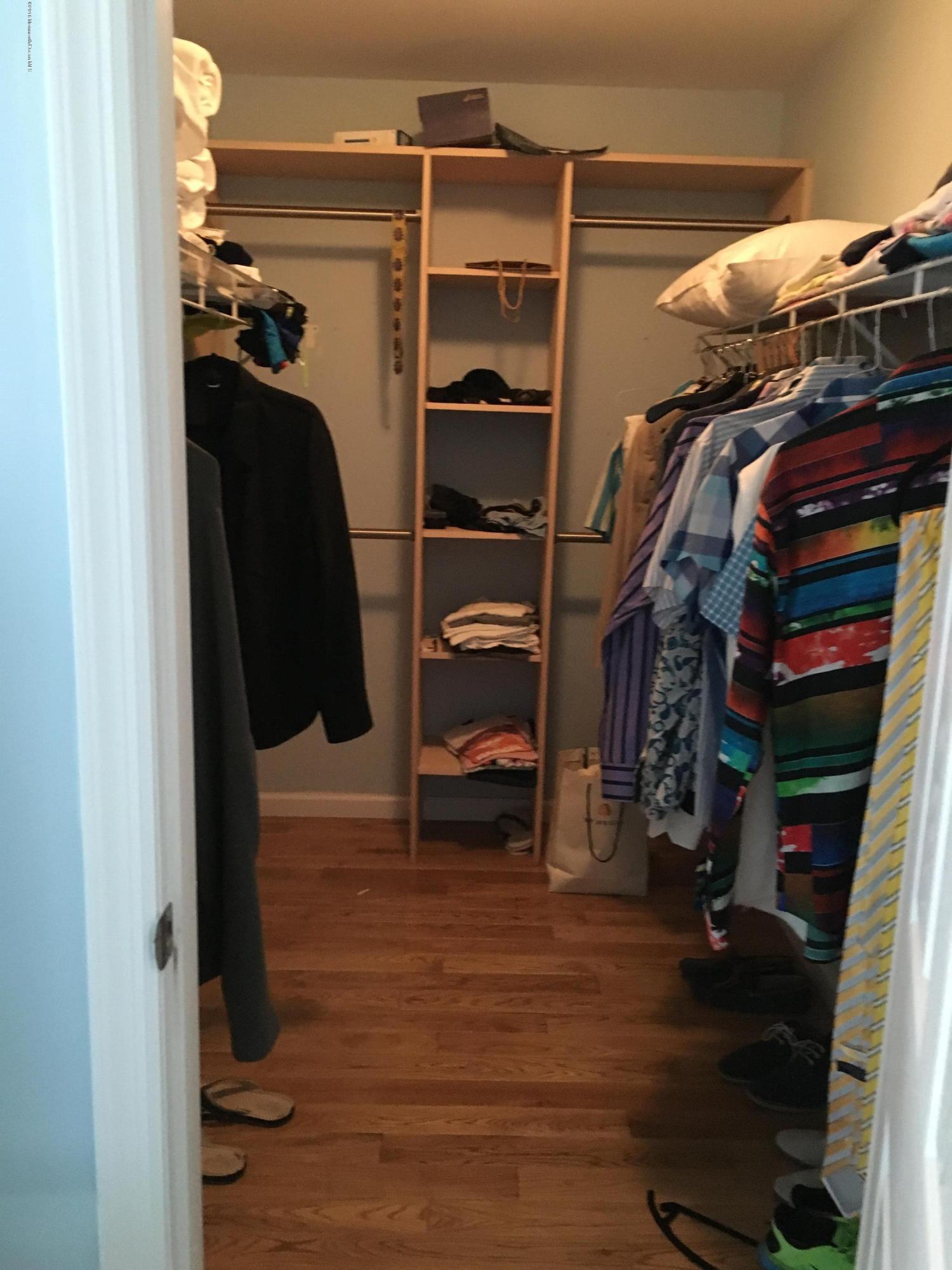 110 Poplar Avenue Deal, NJ 07723 - Photo 3 of 27 a view of walk in closet with clothes and shoes