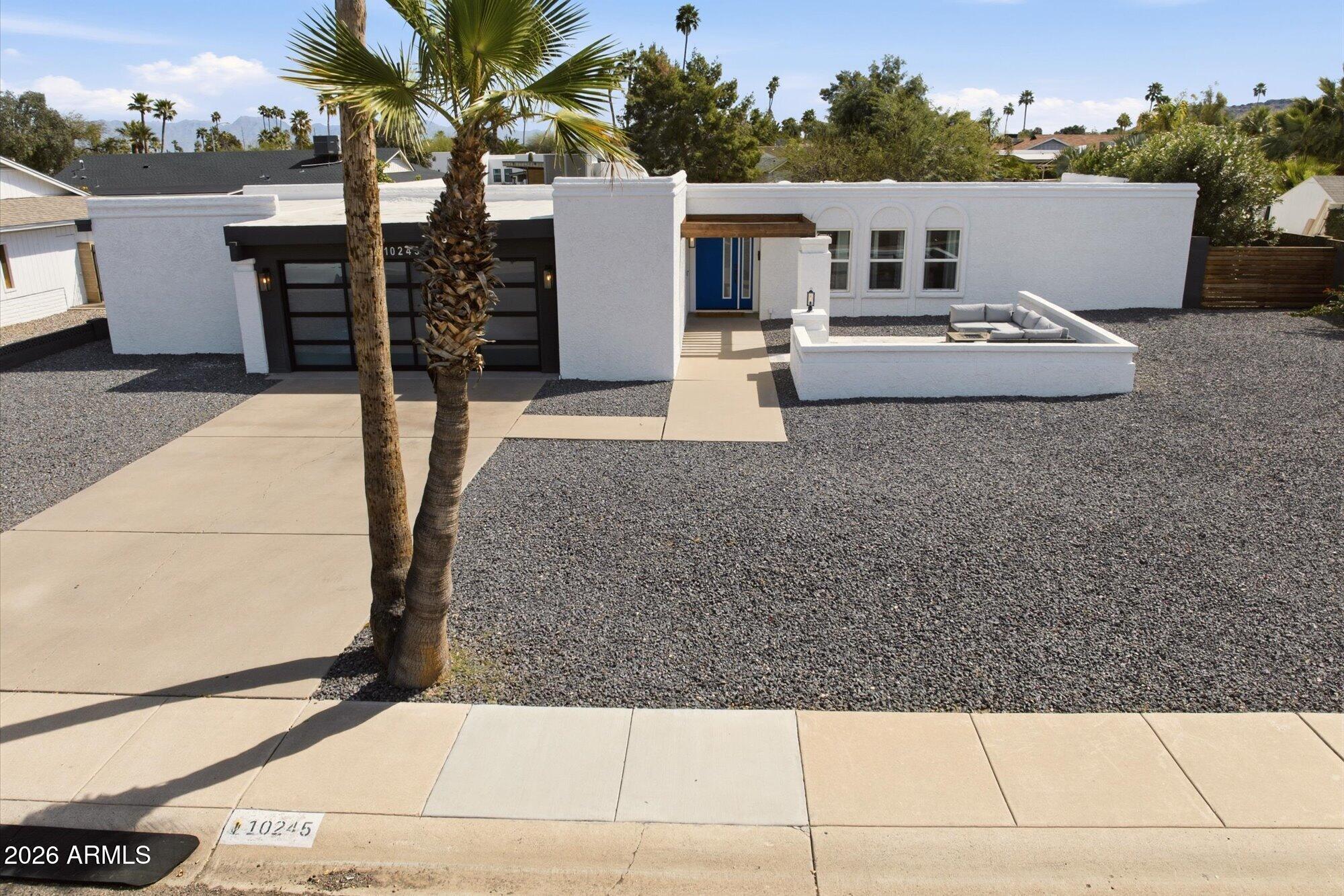 10245 North 34th Place Phoenix, AZ 85028 - Photo 1 of 26 a view of a house with backyard and sitting area