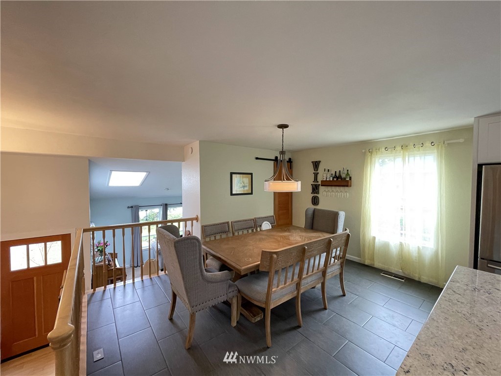 3775 Magrath Road Bellingham, WA 98226 - Photo 22 of 37 a dining room with furniture and wooden floor