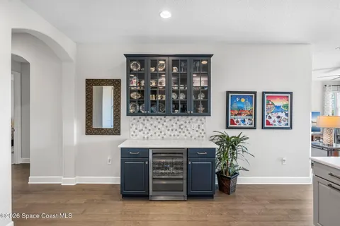 a view of an empty room with a window and a fireplace