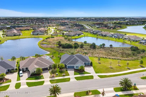 an aerial view of a residential building and lake view