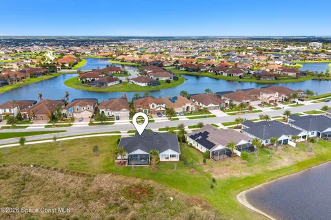 an aerial view of residential house with outdoor space and swimming pool