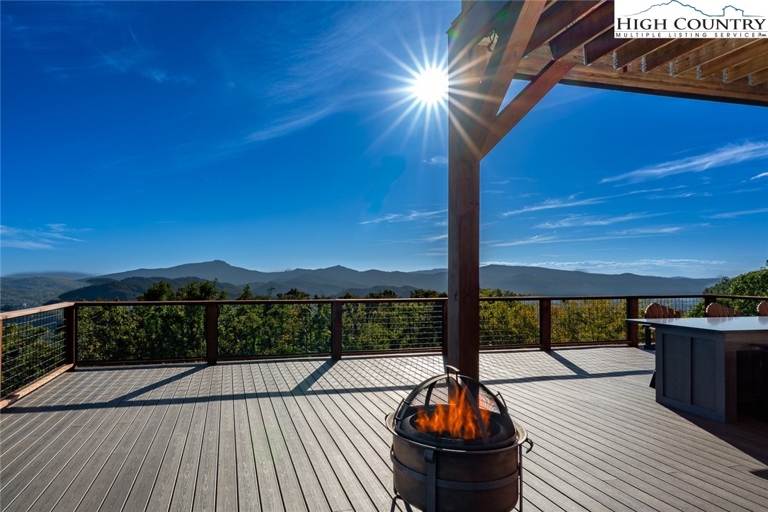 1180 Pinnacle Drive Boone, NC 28607 - Photo 32 of 50 a view of balcony with wooden floor and outdoor seating