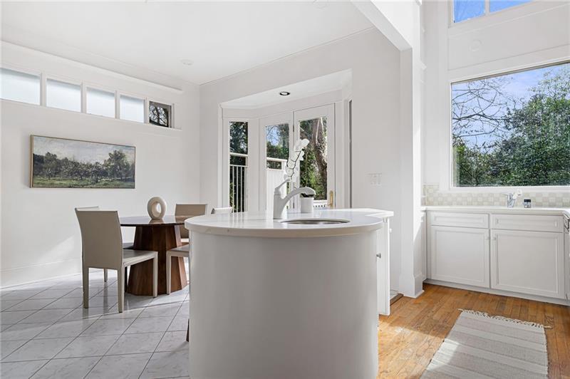 993 Highland View Northeast Atlanta, GA 30306 - Photo 14 of 54 a dining room with kitchen island a table and chairs in it