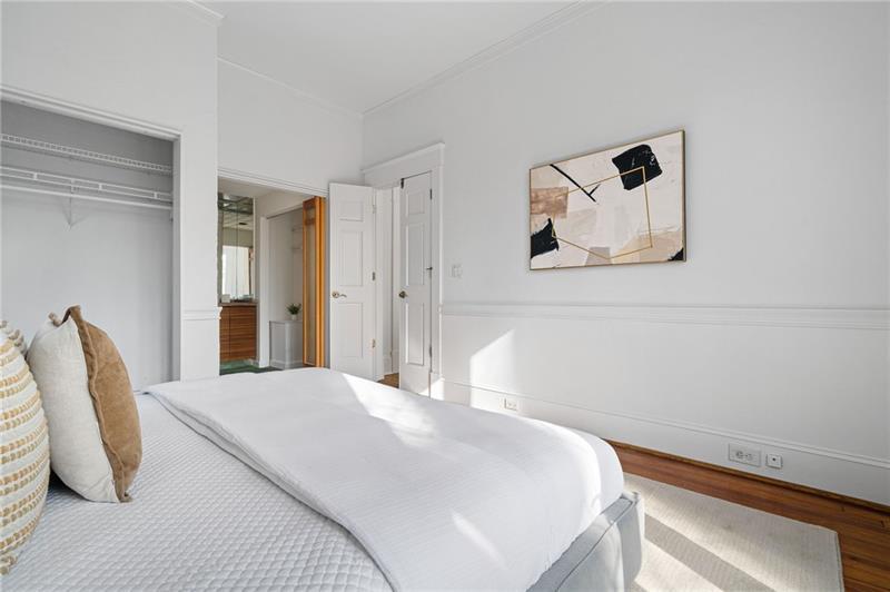 993 Highland View Northeast Atlanta, GA 30306 - Photo 17 of 54 a bedroom with a bed and white chair