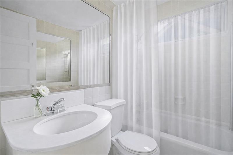 993 Highland View Northeast Atlanta, GA 30306 - Photo 22 of 54 a bathroom with a sink toilet and shower