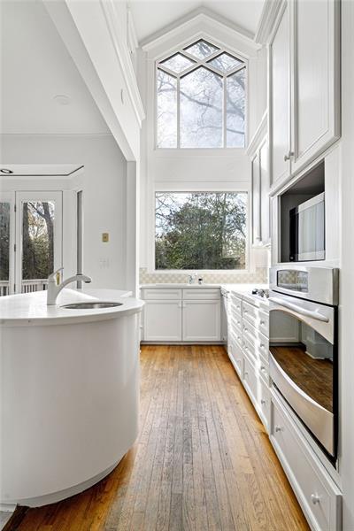 993 Highland View Northeast Atlanta, GA 30306 - Photo 38 of 54 a kitchen with a sink wooden floor and a stove