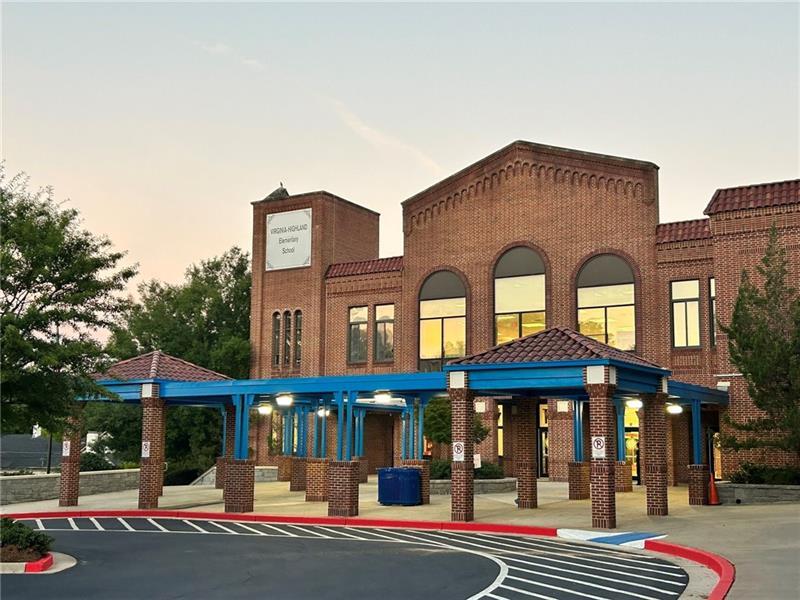 993 Highland View Northeast Atlanta, GA 30306 - Photo 50 of 54 a front view of a residential apartment building with a yard