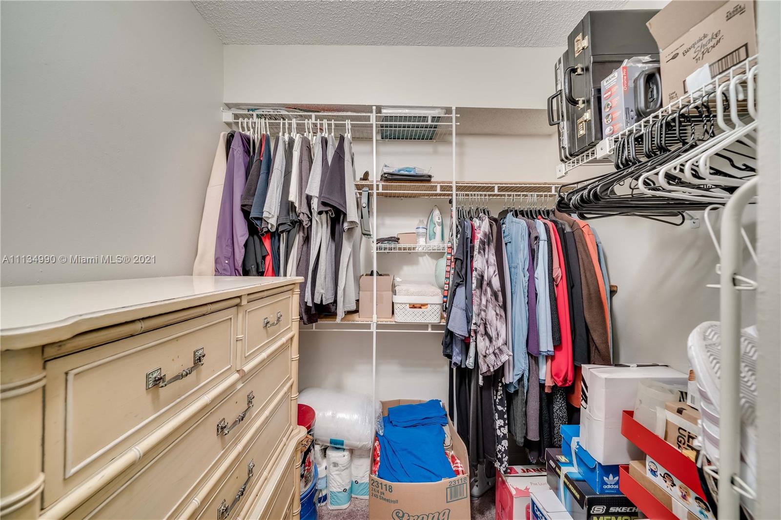 469 North Pine Island Road, Unit B305 Plantation, FL 33324 - Photo 23 of 38 a view of walk in closet with clothes and shoes