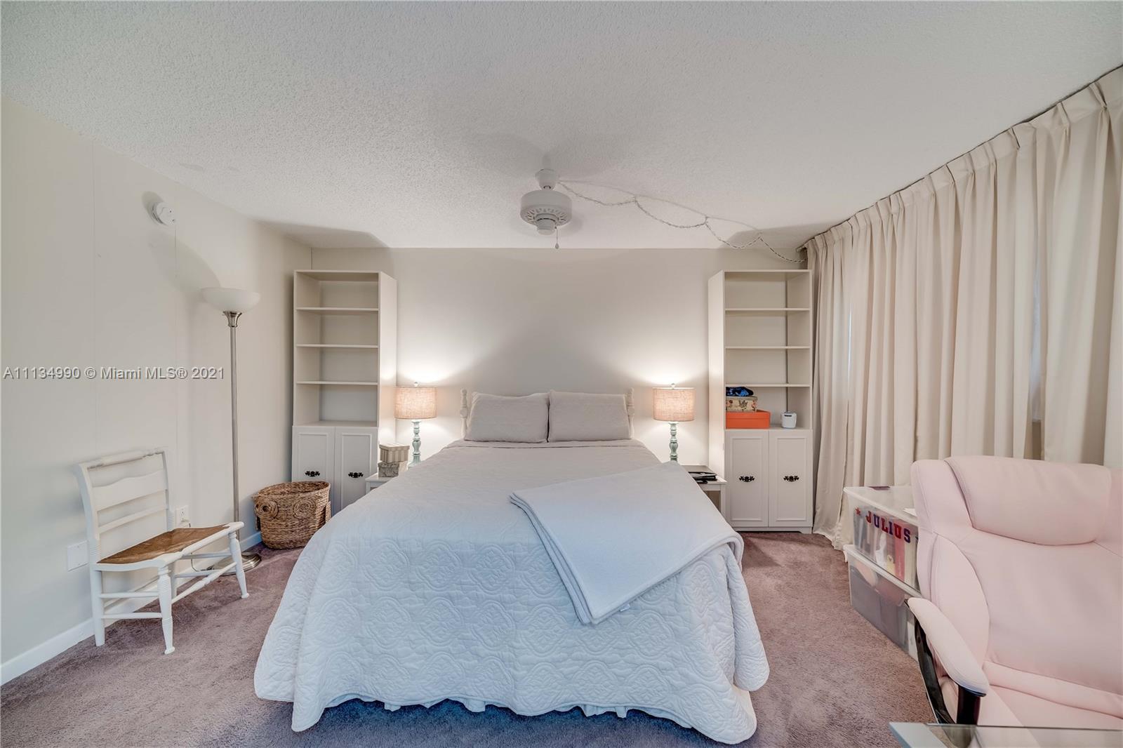 469 North Pine Island Road, Unit B305 Plantation, FL 33324 - Photo 24 of 38 a bedroom with a bed and lamp