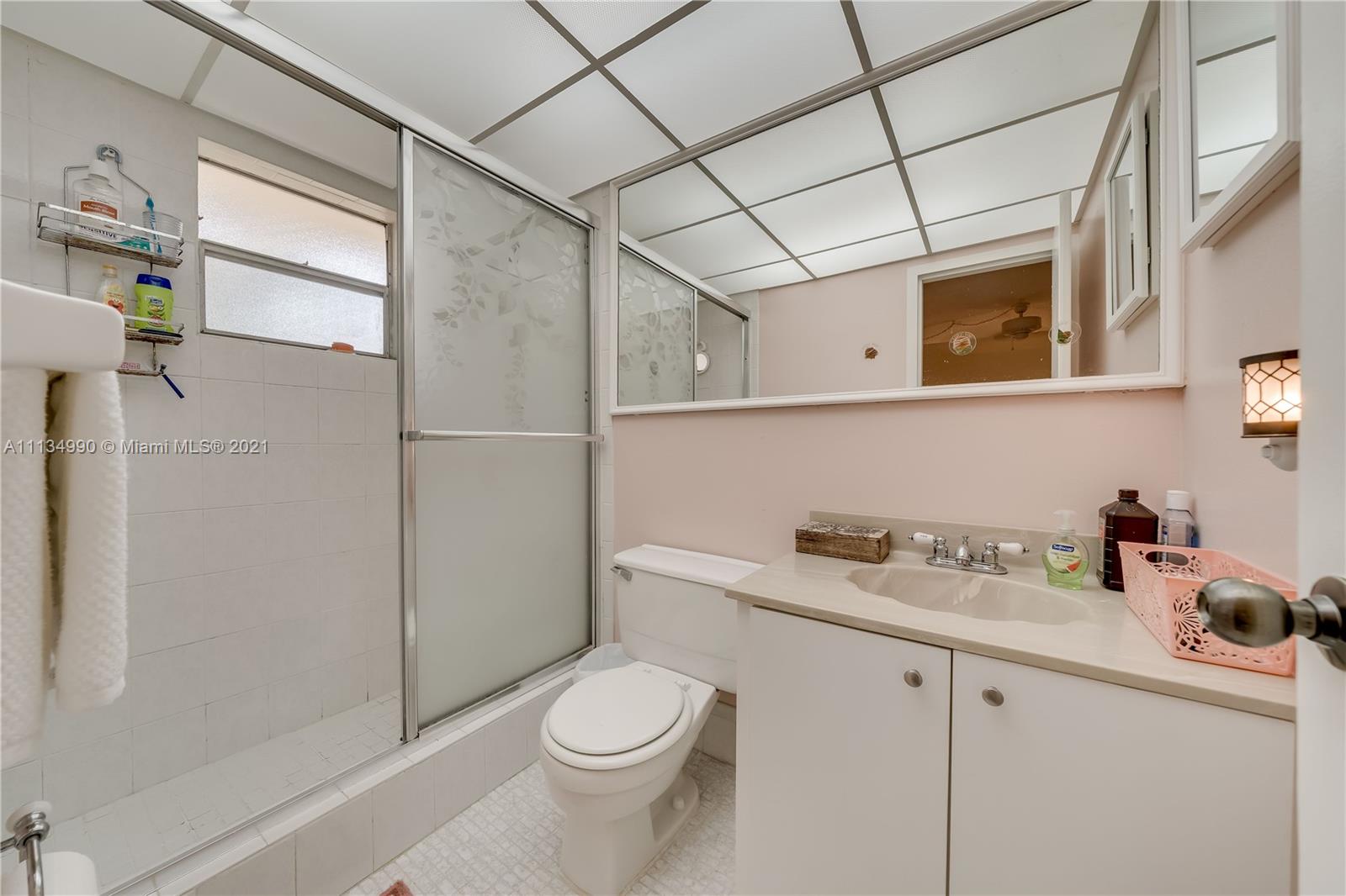 469 North Pine Island Road, Unit B305 Plantation, FL 33324 - Photo 26 of 38 a bathroom with a sink a toilet and shower
