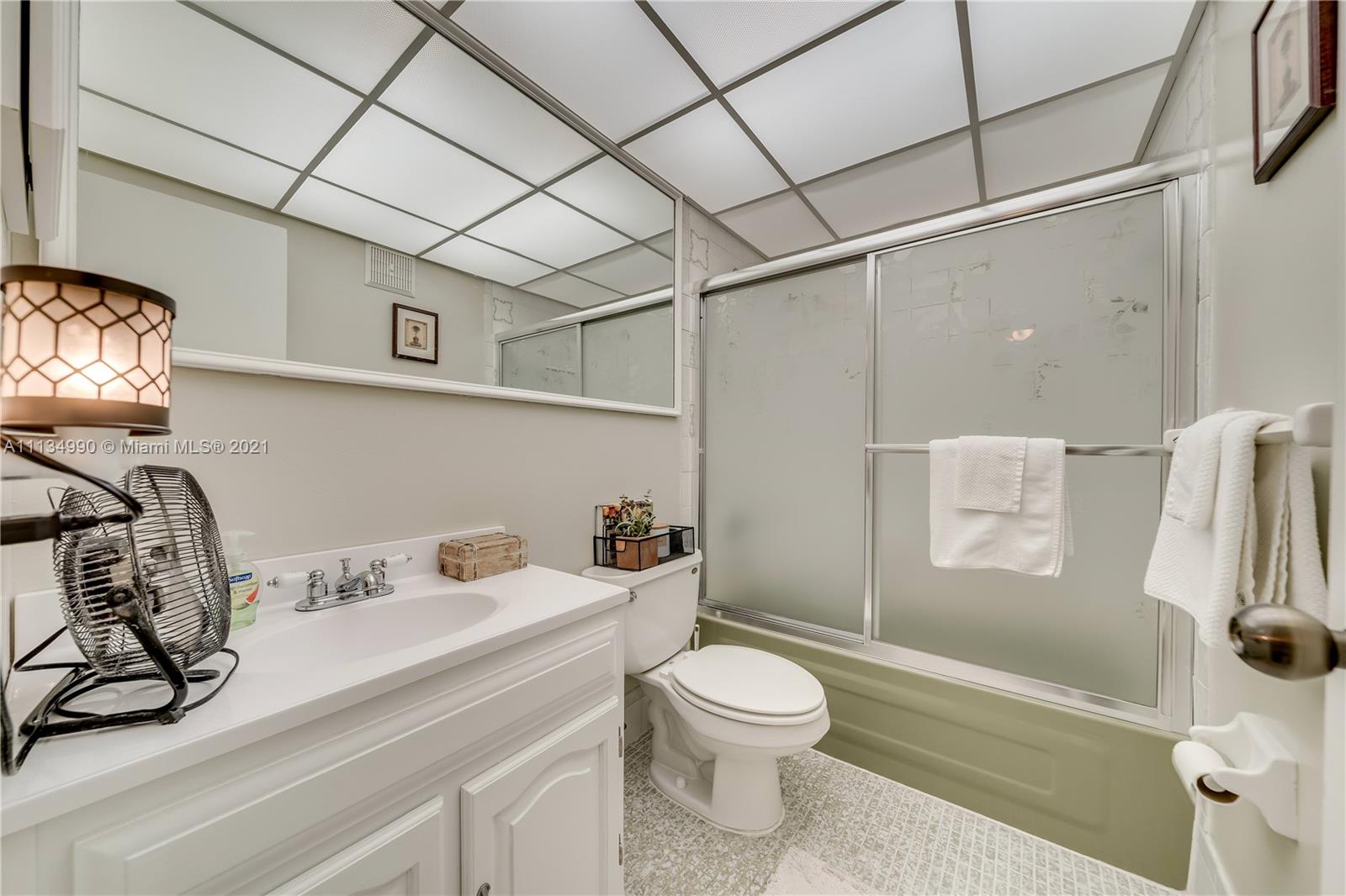 469 North Pine Island Road, Unit B305 Plantation, FL 33324 - Photo 27 of 38 a bathroom with a sink a toilet and shower