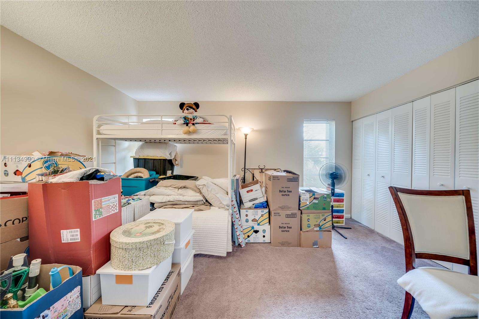 469 North Pine Island Road, Unit B305 Plantation, FL 33324 - Photo 28 of 38 a bed room with a bed and a chair