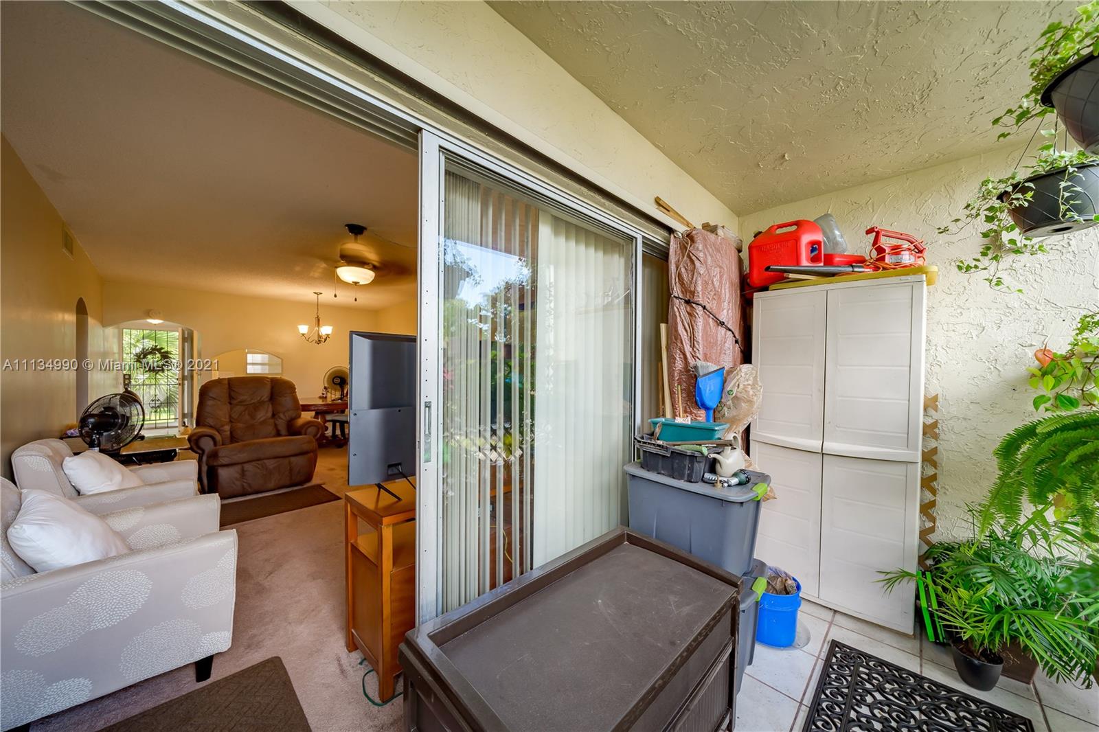 469 North Pine Island Road, Unit B305 Plantation, FL 33324 - Photo 34 of 38 a living room with furniture and a potted plant