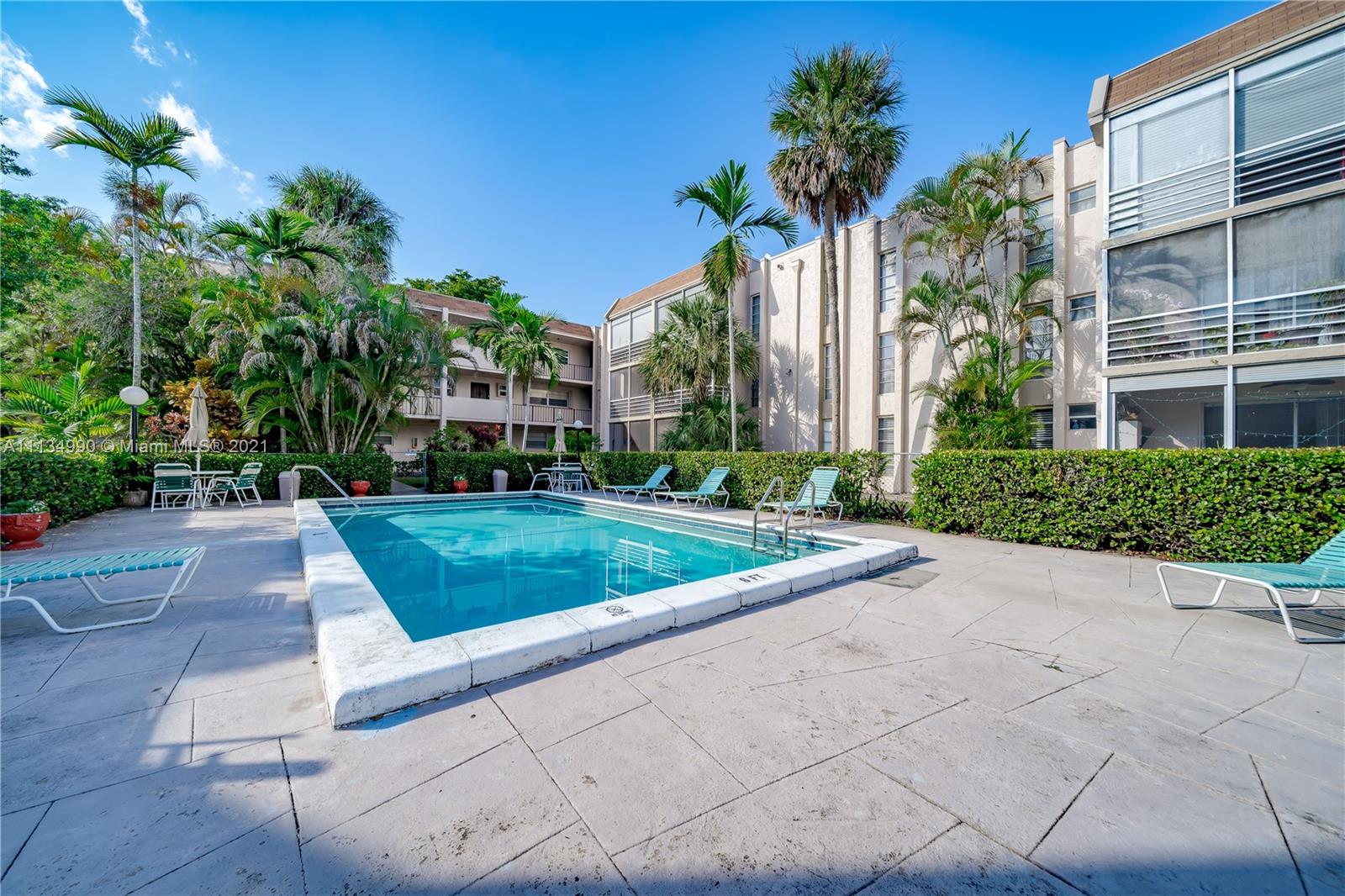 469 North Pine Island Road, Unit B305 Plantation, FL 33324 - Photo 37 of 38 a view of a garden with a building