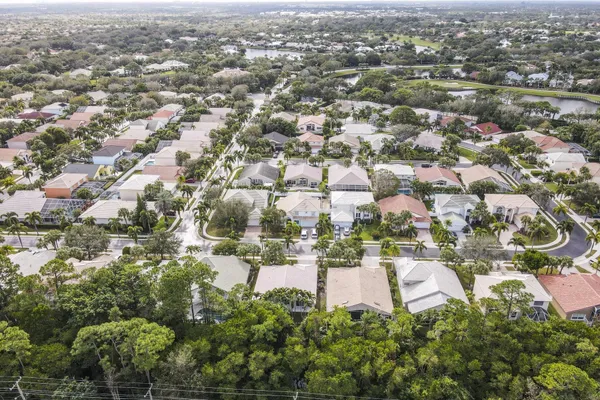 an aerial view of residential building with green space