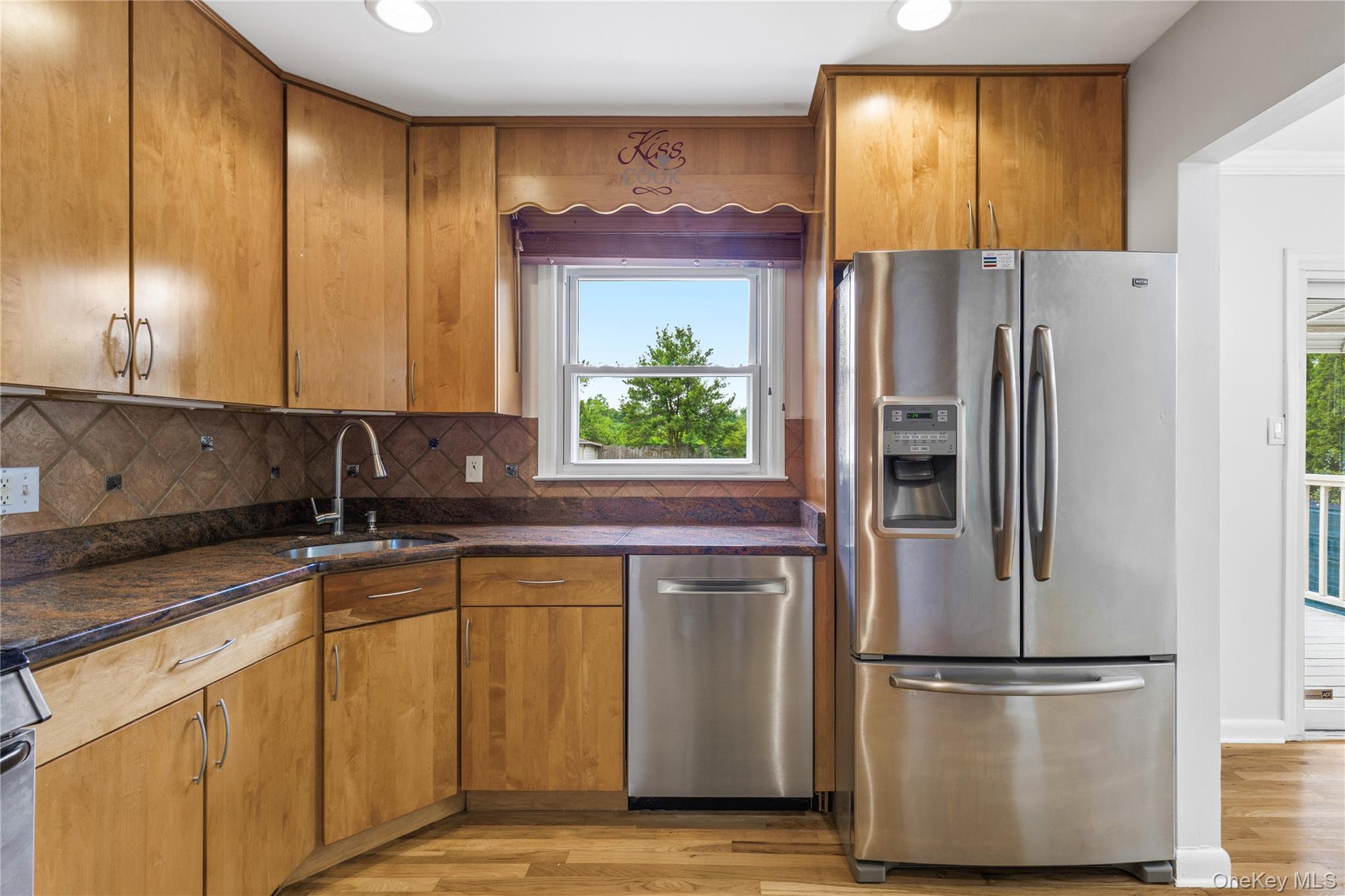 46 Mathews Street Harrison, NY 10528 - Photo 12 of 30 a kitchen with stainless steel appliances granite countertop a refrigerator and a sink