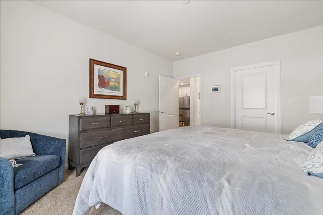 a bathroom with a toilet a sink and a mirror