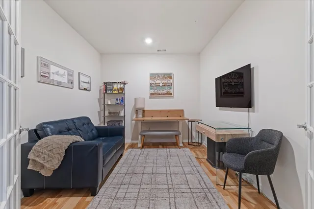 a view of a room with gym equipment and a window