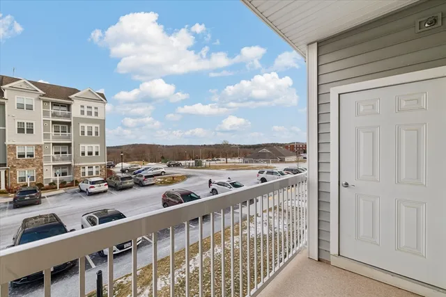 a view of a livingroom with furniture and a gym cycle