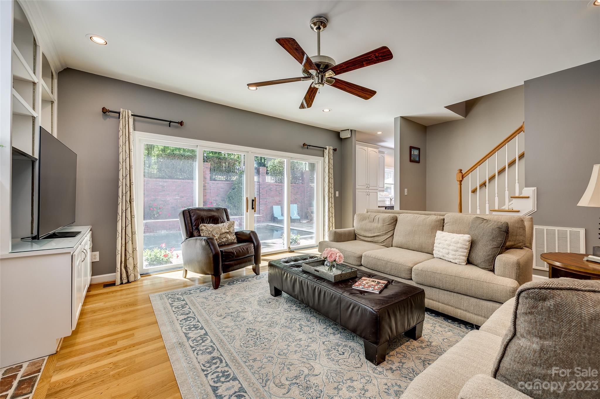 12005 Forest Garden Fort Mill, SC 29708 - Photo 11 of 48 a living room with furniture ceiling fan and a rug