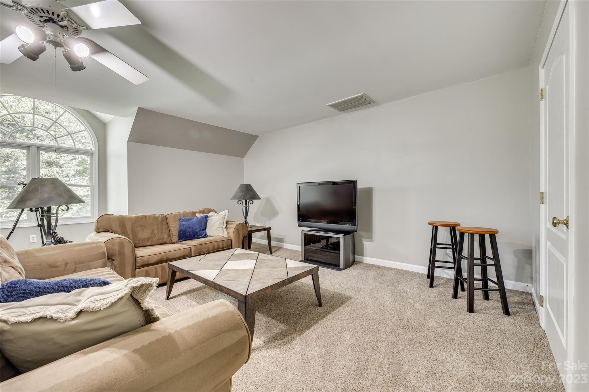 12005 Forest Garden Fort Mill, SC 29708 - Photo 22 of 48 a living room with furniture and a flat screen tv