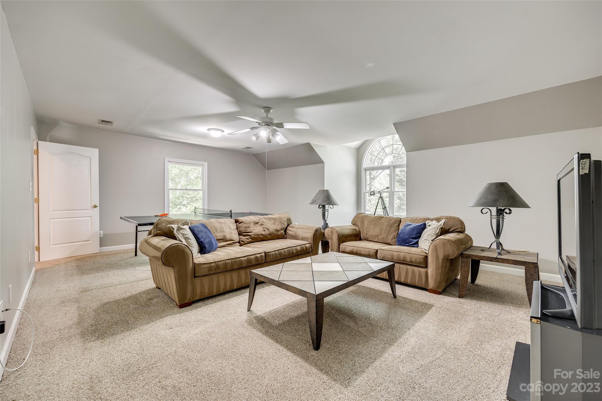 12005 Forest Garden Fort Mill, SC 29708 - Photo 23 of 48 a living room with furniture and a chandelier