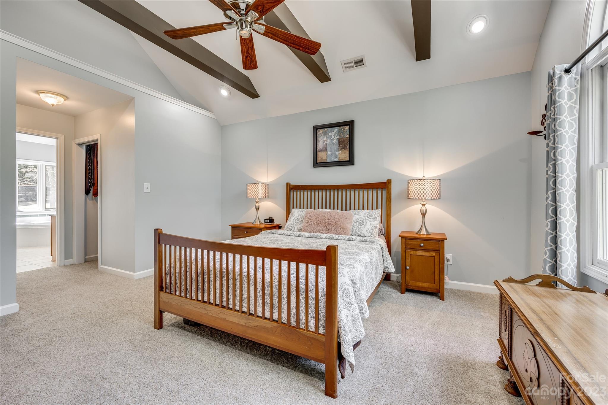 12005 Forest Garden Fort Mill, SC 29708 - Photo 27 of 48 a bed room with a bed and a chandelier