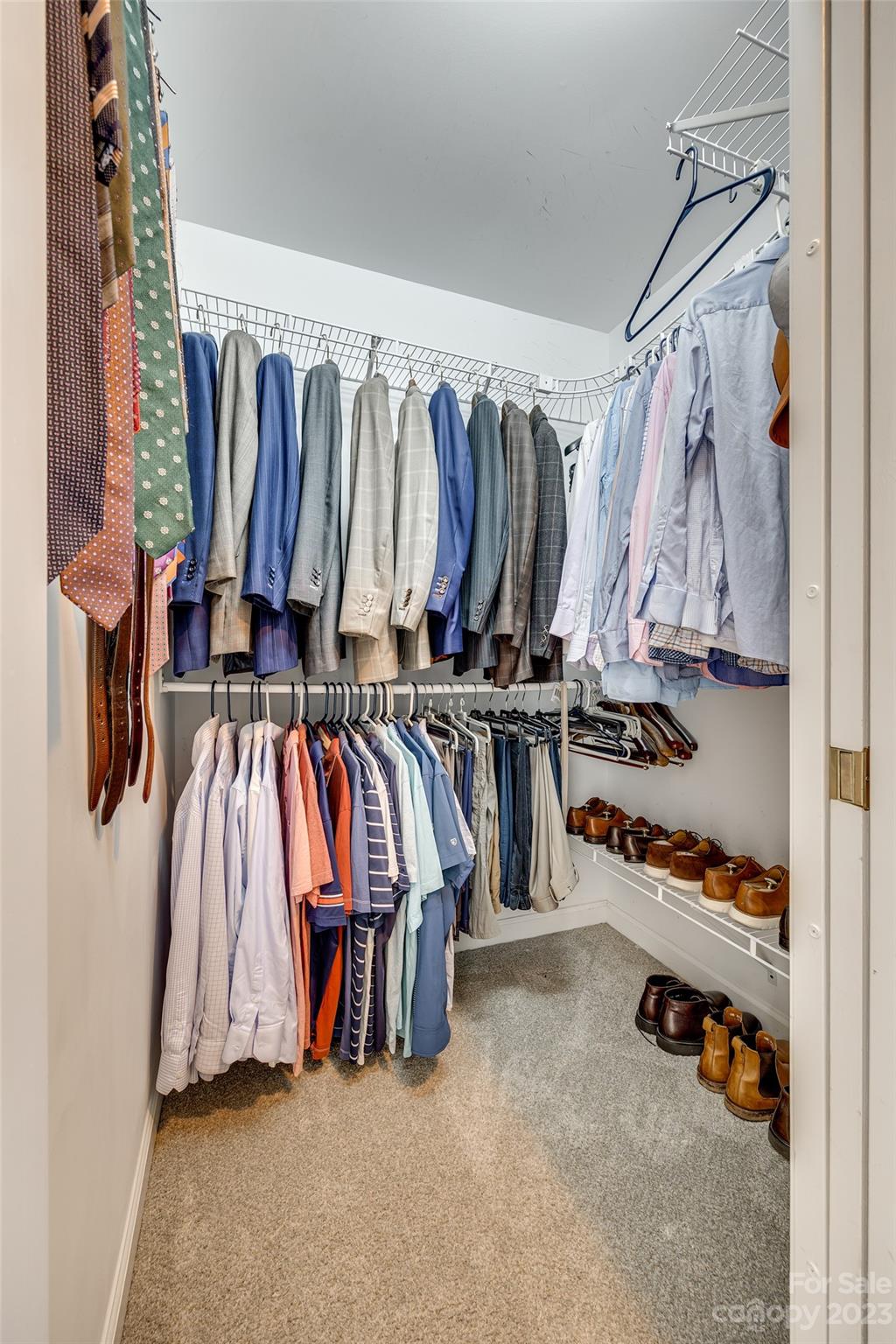 12005 Forest Garden Fort Mill, SC 29708 - Photo 29 of 48 a view of walk in closet with clothes and shoes