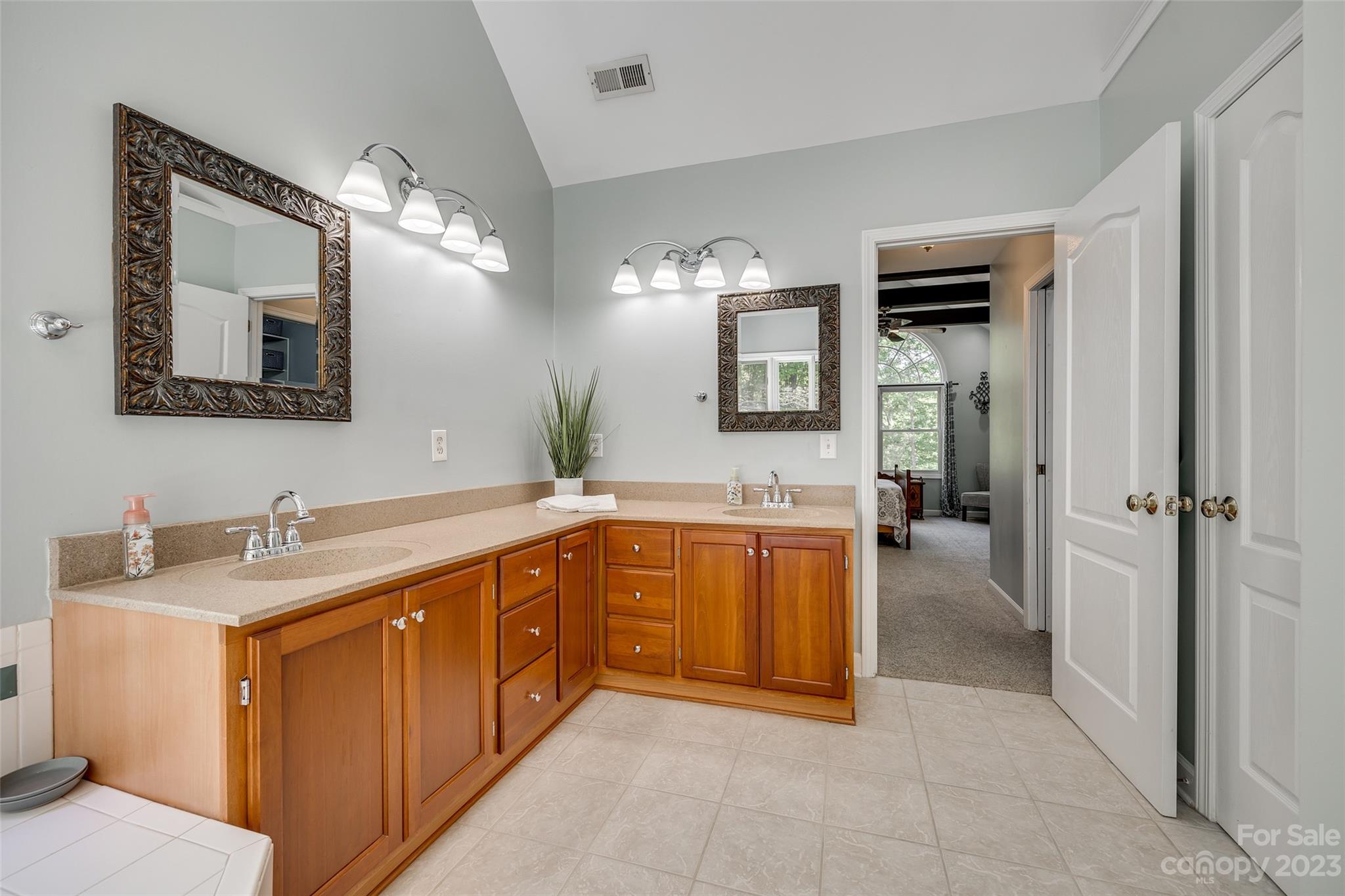 12005 Forest Garden Fort Mill, SC 29708 - Photo 32 of 48 a spacious bathroom with a granite countertop sink mirror and