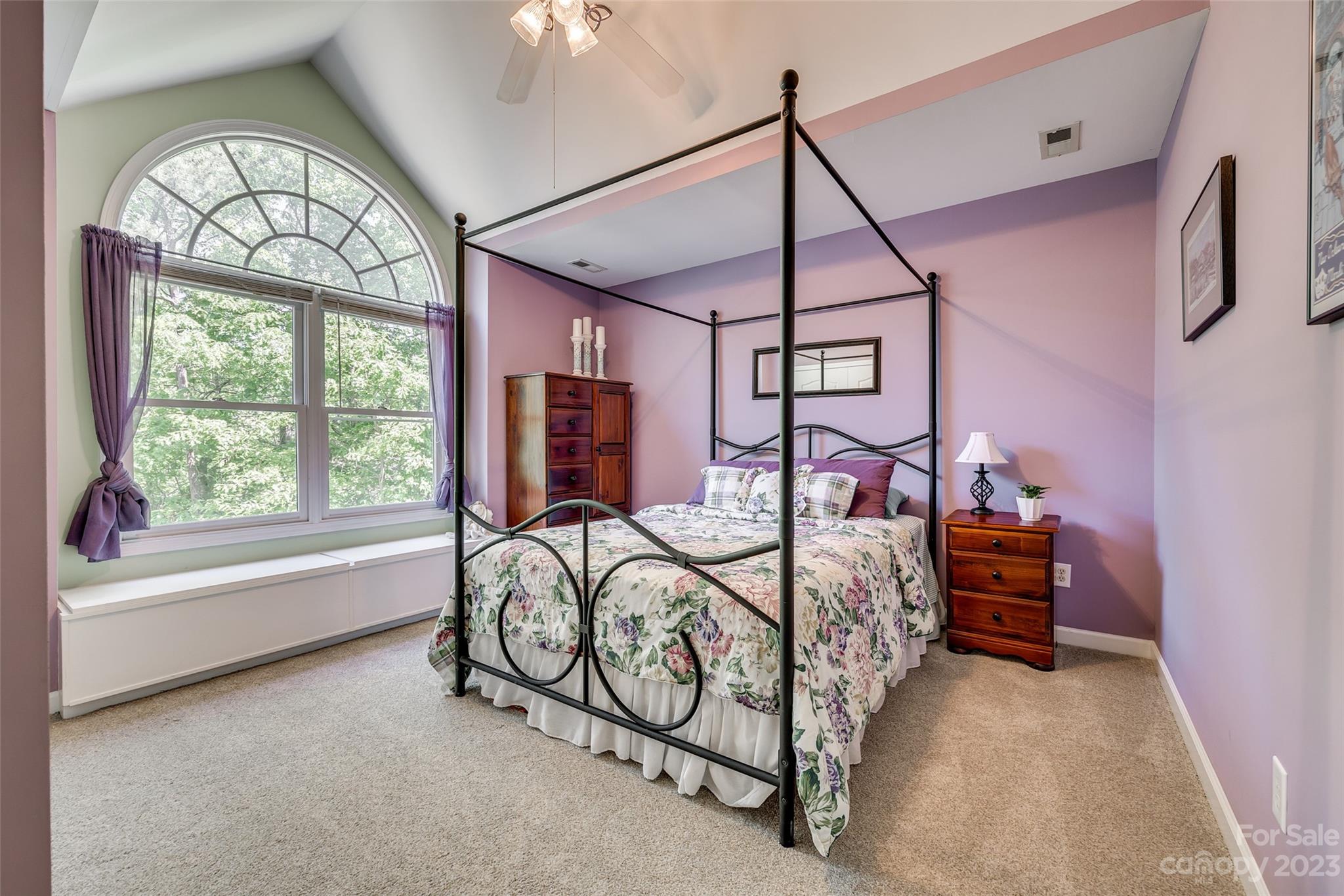 12005 Forest Garden Fort Mill, SC 29708 - Photo 34 of 48 a bedroom with a bed and a chandelier