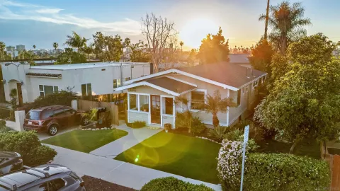 an aerial view of a house with swimming pool