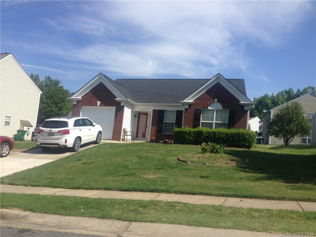 14027 Dingess Road Charlotte, NC 28273 - Photo 1 of 1 a front view of a house with a yard