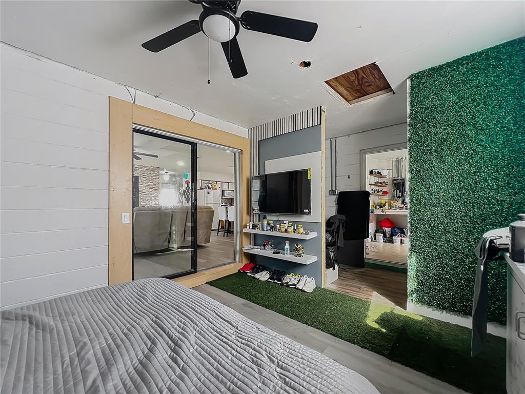 20 Lake Ct Loop Ocala, FL 34472 - Photo 16 of 33 a bedroom with furniture and a flat screen tv