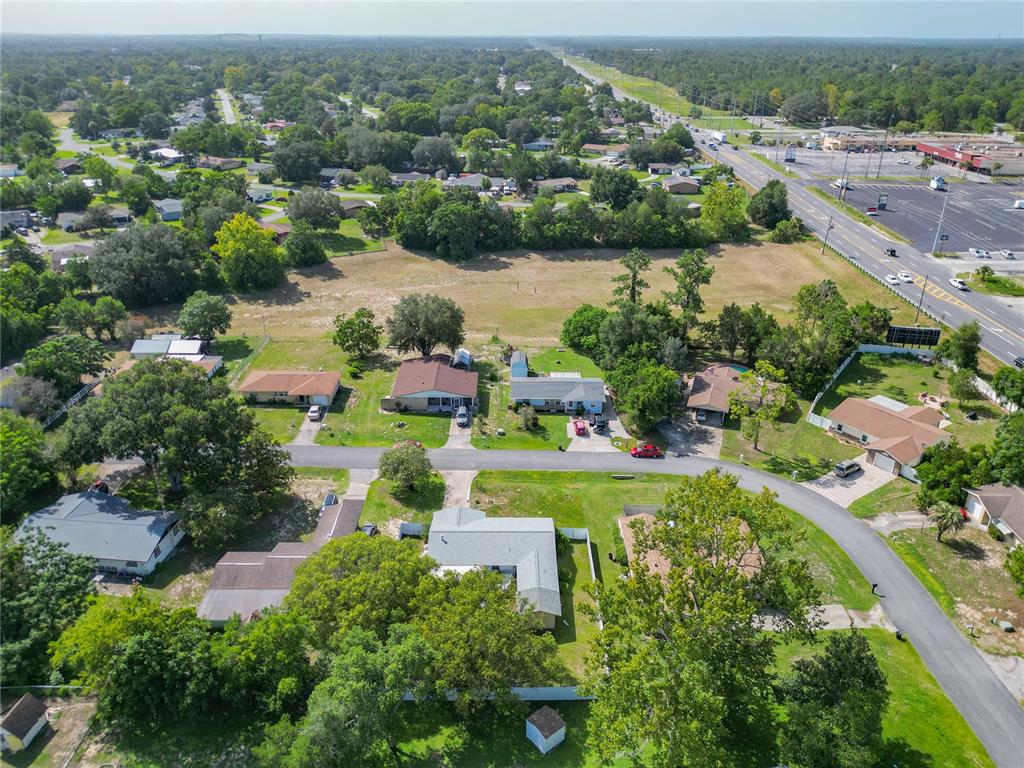 20 Lake Ct Loop Ocala, FL 34472 - Photo 31 of 33 an aerial view of lake residential houses with outdoor space and trees