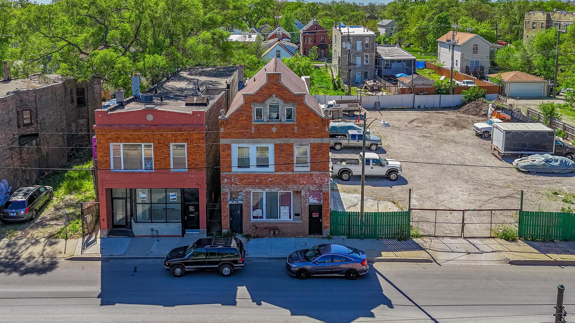 a front view of a house with sitting area