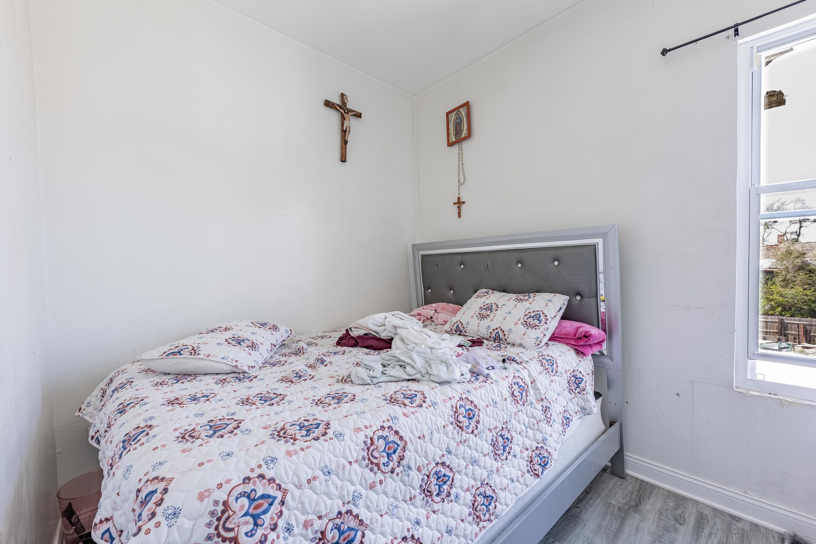 1638 South Pulaski Road Chicago, IL 60623 - Photo 12 of 22 a bedroom with a bed and a window